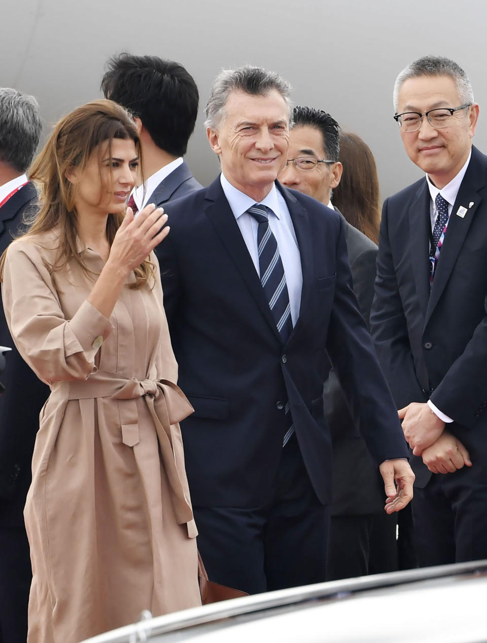 Argentina's President Mauricio Macri, center right, and his wife first lady Juliana Awada arrive at Kansai International Airport in Izumisano, Osaka prefecture, western Japan, Thursday, June 27, 2019. Group of 20 leaders gather in Osaka on June 28 and 29 for their annual summit.(Nobuki Ito/Kyodo News via AP)
