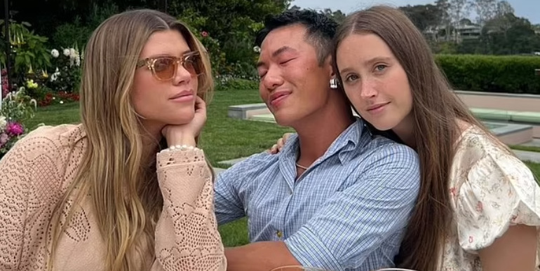 a group of people sitting at a table with drinks