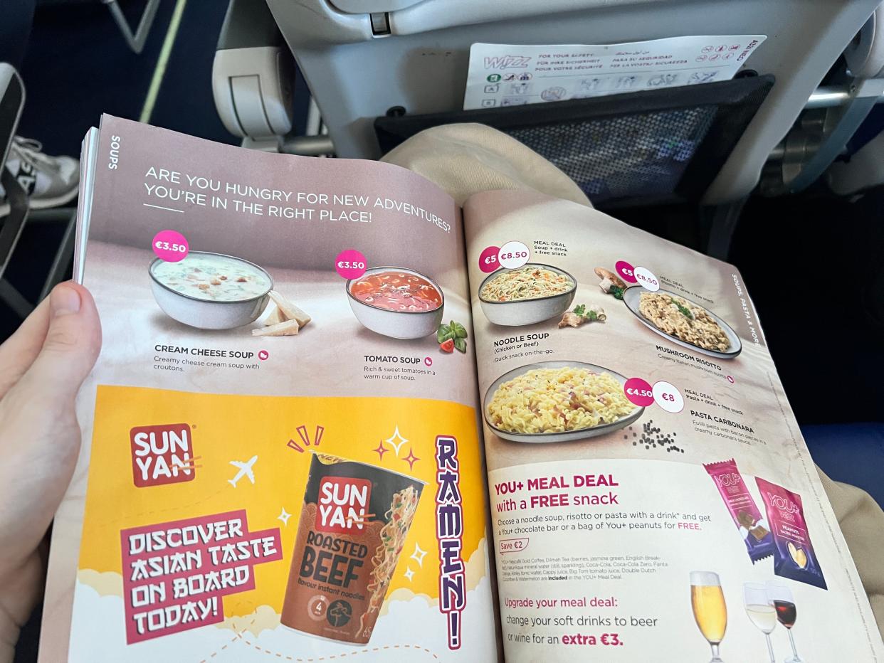 A catalogue of food available to order on board a Wizz Air flight.