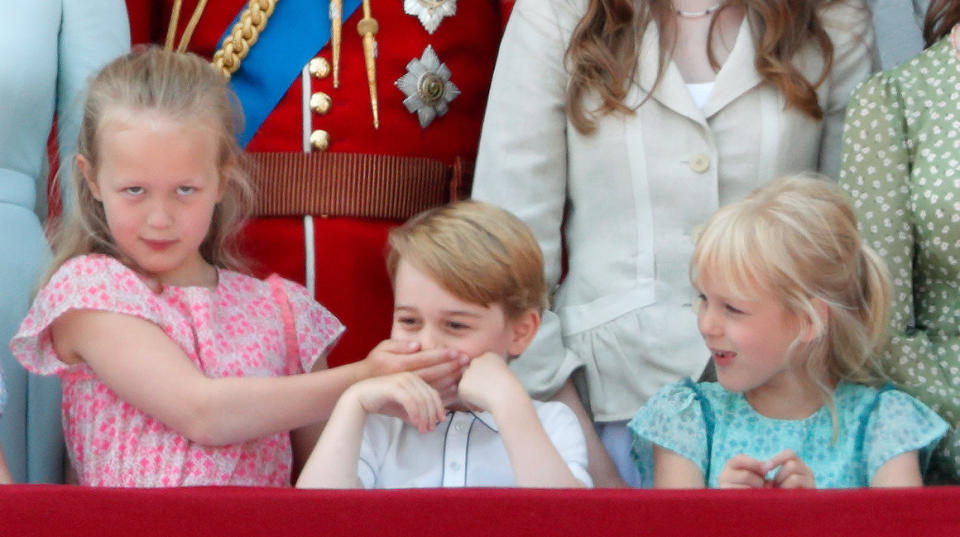 Savannah Phillips puts her hand over Prince George's mouth to keep her younger cousin quiet at Trooping the Color.&nbsp;The parade marks the official birthday of the Sovereign, even though the Queen's actual birthday is on April 21.&nbsp; (Photo: Max Mumby/Indigo via Getty Images)