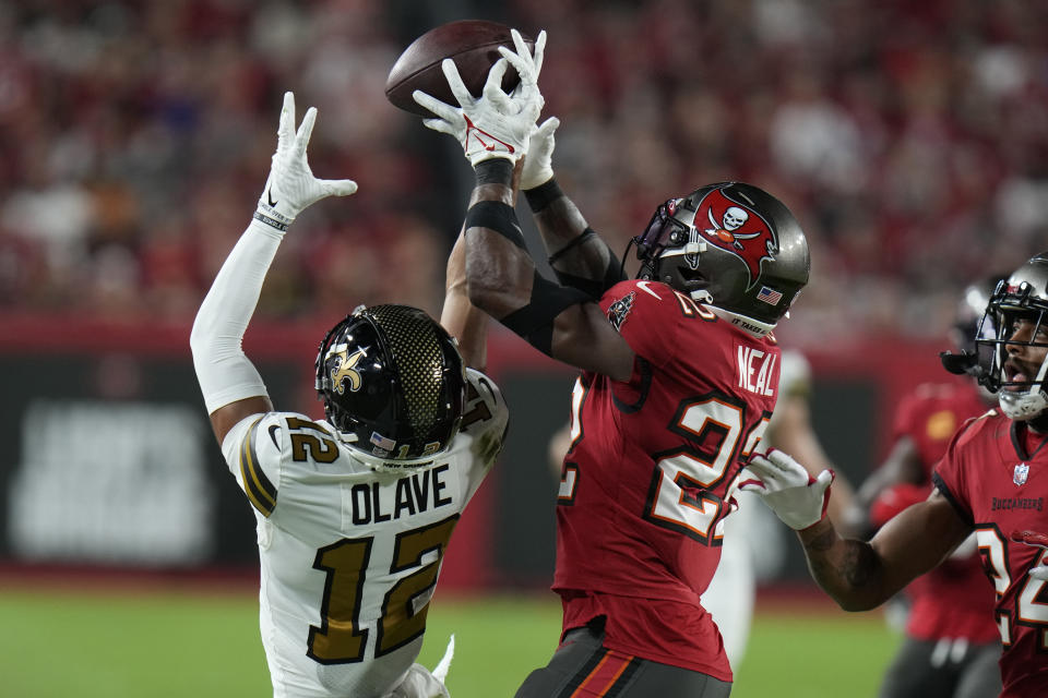 Tampa Bay Buccaneers safety Keanu Neal (22) brake up a pass intended for New Orleans Saints wide receiver Chris Olave (12) in the first half of an NFL football game in Tampa, Fla., Monday, Dec. 5, 2022. (AP Photo/Chris O'Meara)