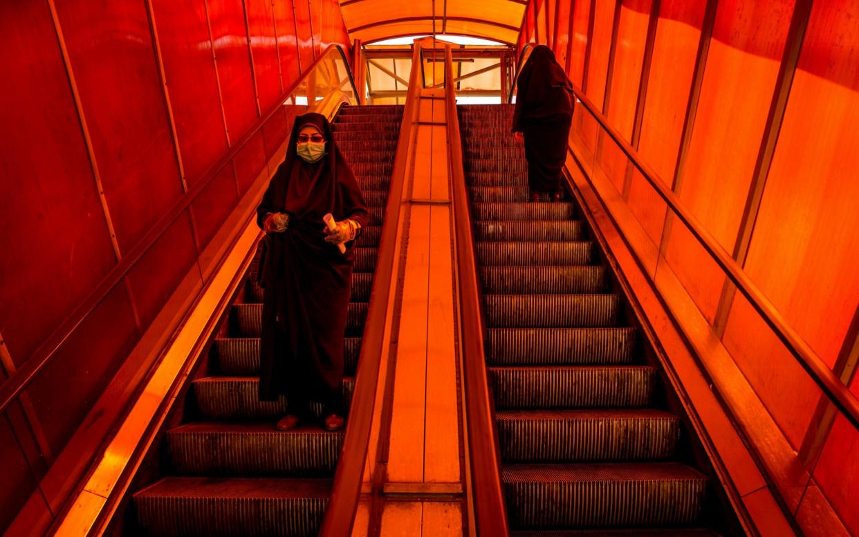 Women on public transport in coronavirus-stricken Iran  - Bloomberg/Ali Mohammadi