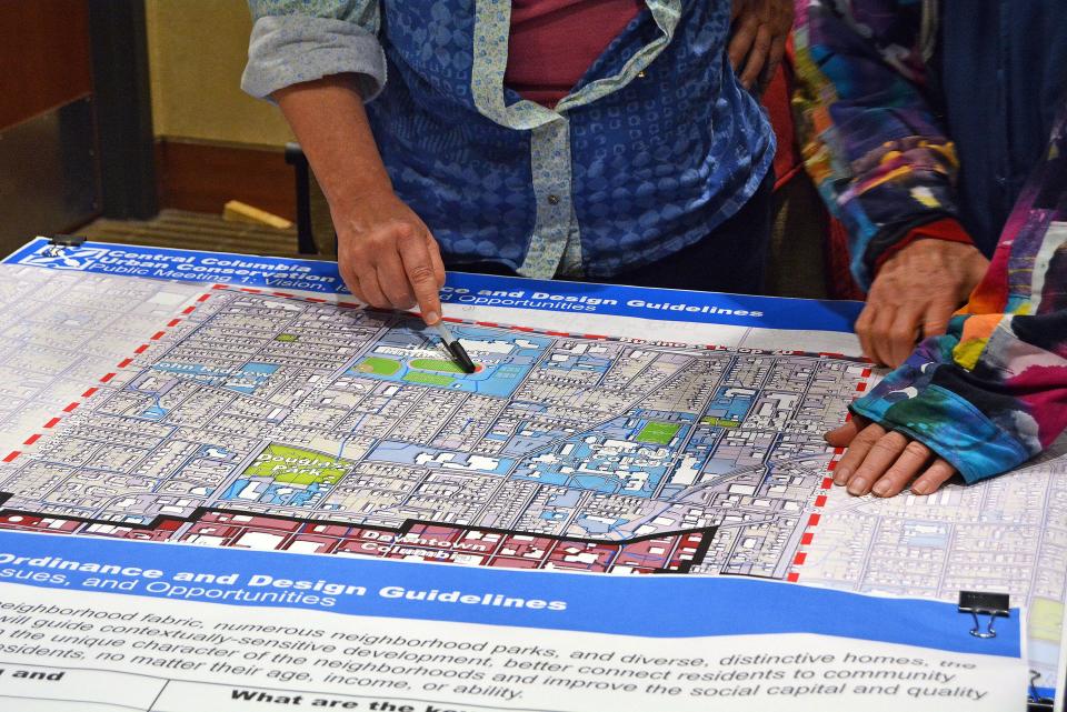 Residents review a section of a central Columbia map Wednesday at Columbia City Hall to provide feedback on what eventually will become central Columbia urban conservation regulations.