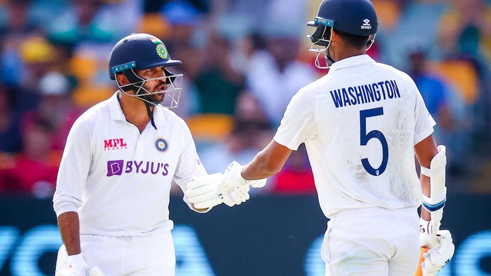 Shardul Thakur and Washington Sundar, pictured here celebrating their 100-run partnership at the Gabba.