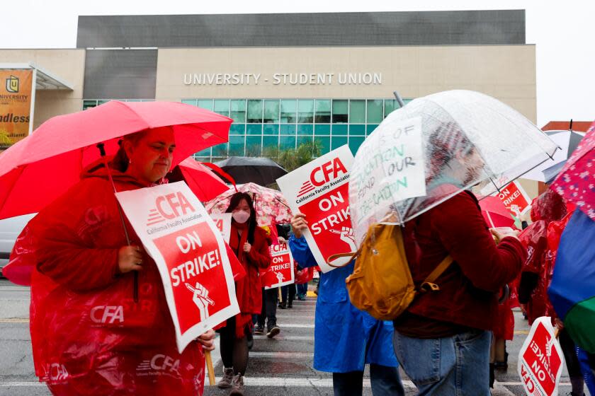 LOS ANGELES, CA - JANUARY 22: Members of the faculty union at Cal State Los Angeles brave the elements Monday morning, Jan. 22, 2024, as they begin a one week strike. The union representing 29,000 faculty members at California State University, the nation's largest four-year public university system, walked off the job for five days Monday, disrupting the first week of the spring semester for tens of thousands of students. (Jay L. Clendenin / Los Angeles Times)