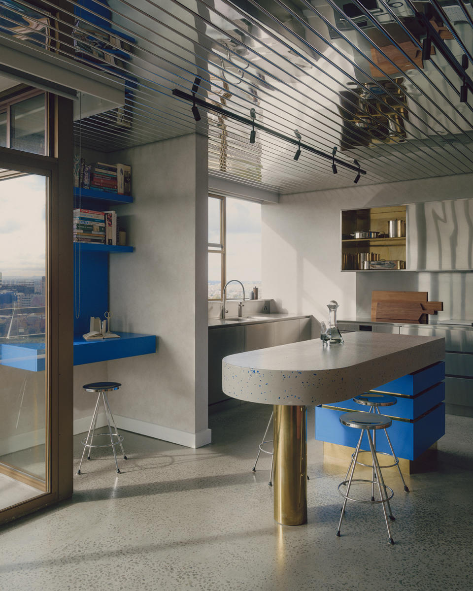 modern kitchen with rounded island and stainless steel cabinets