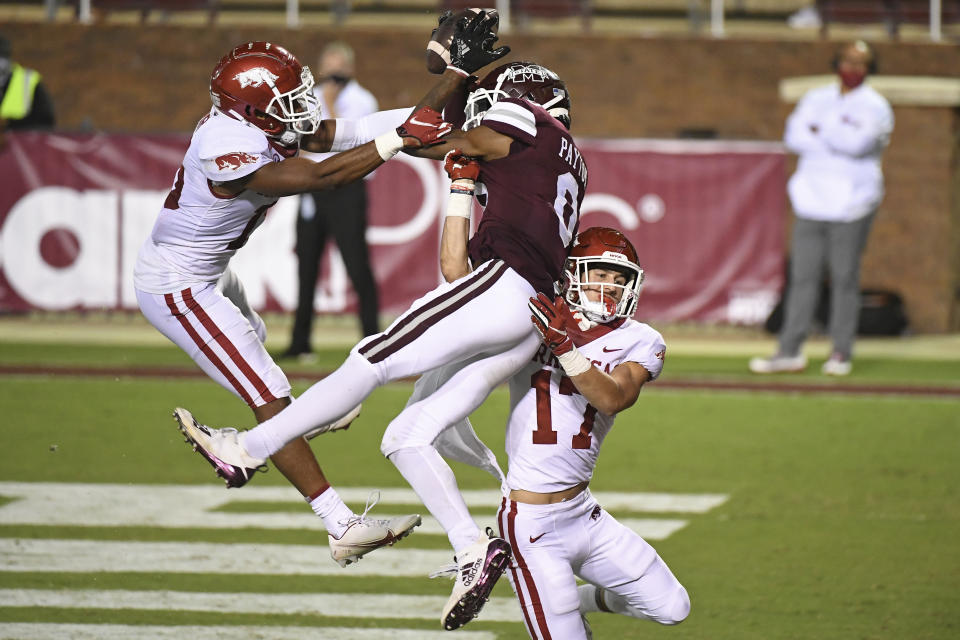 Arkansas defensive backs Simeon Blair (15) and Hudson Clark (17) break up a pass intended for Mississippi State wide receiver JaVonta Payton (0) during the second half of an NCAA college football game in Starkville, Miss., Saturday, Oct. 3, 2020. Arkansas won 21-14. (AP Photo/Thomas Graning)
