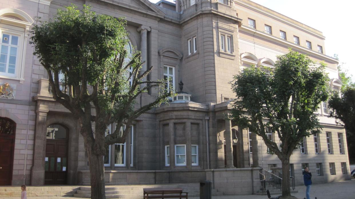 Jersey's Royal Court building from the outside. It is a large ornate stone building.