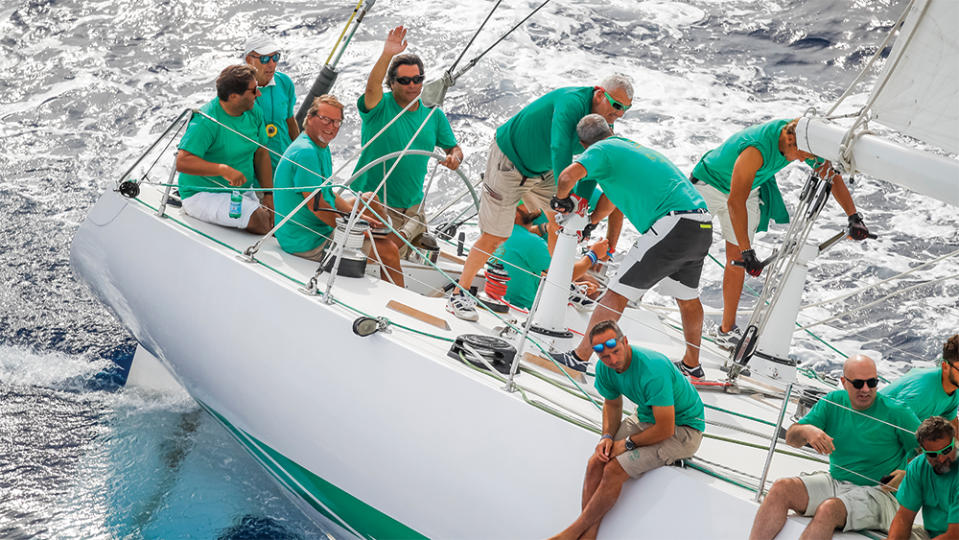 Max Ferruzzi (at the helm) and his crew on Il Moro di Venezia I during a regatta, 2018. - Credit: Courtesy of Max Ferruzzi