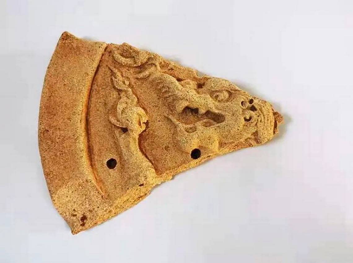 Fragment of tile with a dragon pattern.