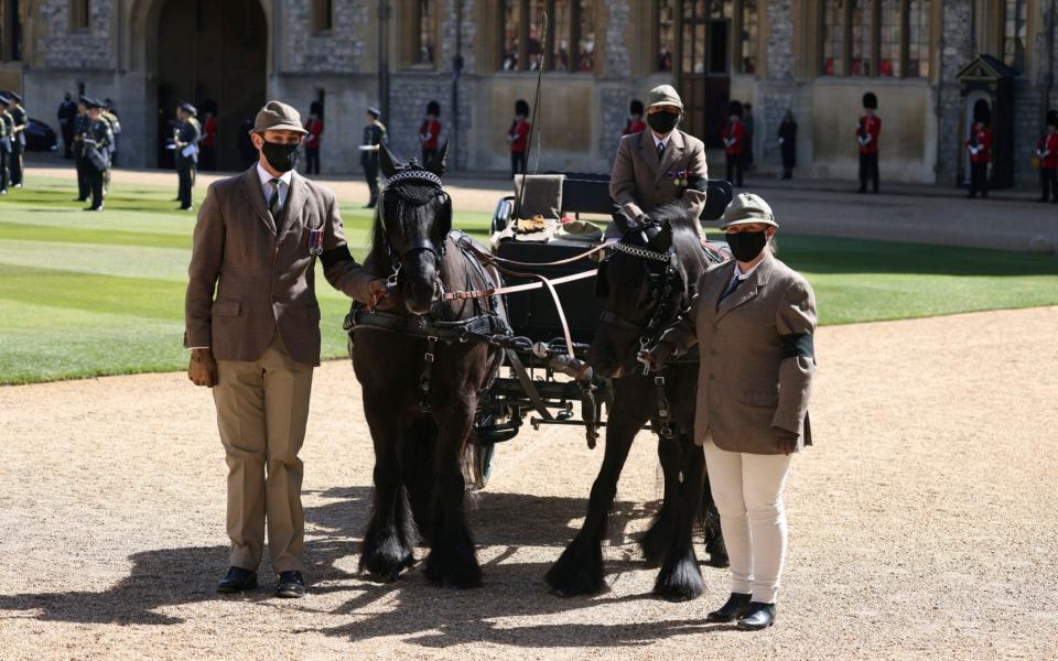 Fell ponies Balmoral Nevis and Notlaw Storm, and the Duke of Edinburgh's driving carriage, pause, in the Quadrangle - Pool via AP