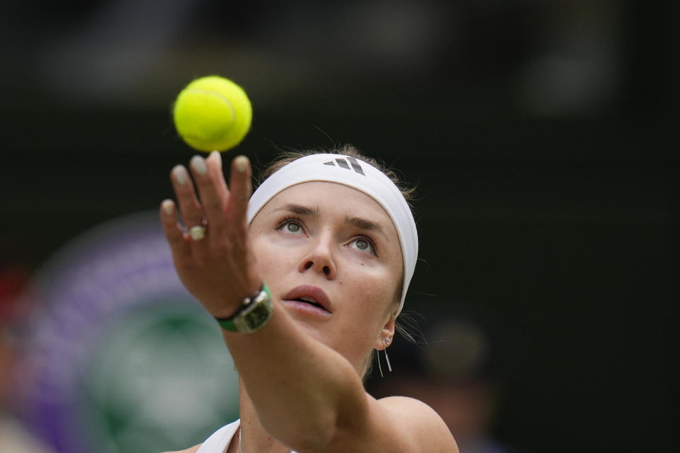 Elina Svitolina of Ukraine serves to Elena Rybakina of Kazakhstan during their quarterfinal match at the Wimbledon tennis championships in London, Wednesday, July 10, 2024. (AP Photo/Kirsty Wigglesworth)