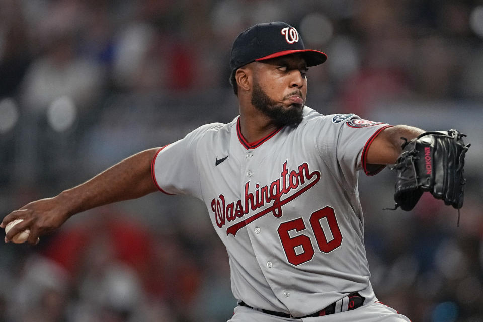 Washington Nationals starting pitcher Joan Adon works against the Atlanta Braves in the first inning of a baseball game, Saturday, Sept. 30, 2023, in Atlanta. (AP Photo/John Bazemore)