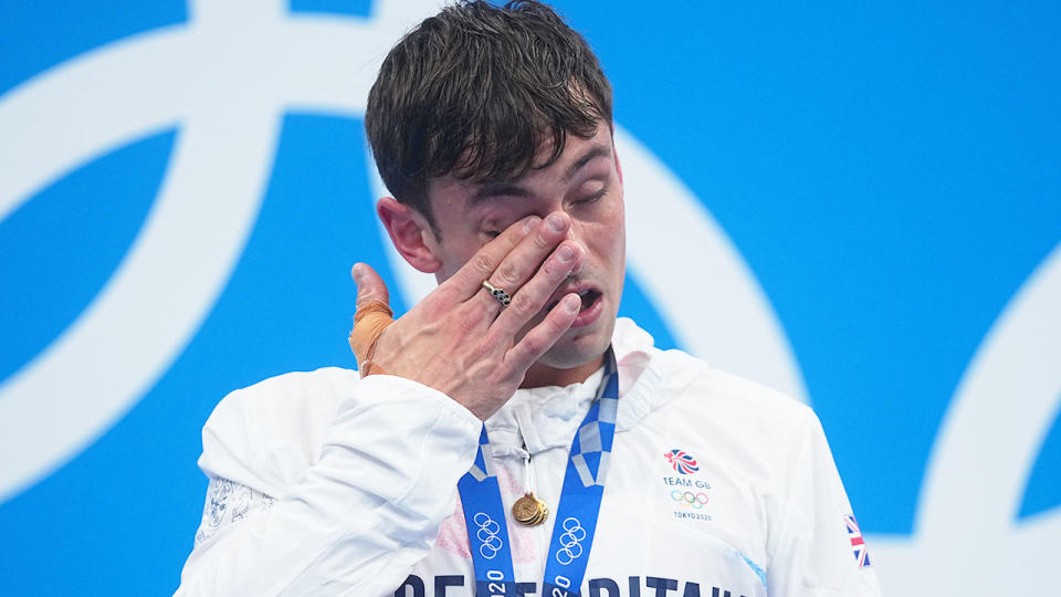 Seen here, British diving champion Tom Daley on the podium at the Olympics.