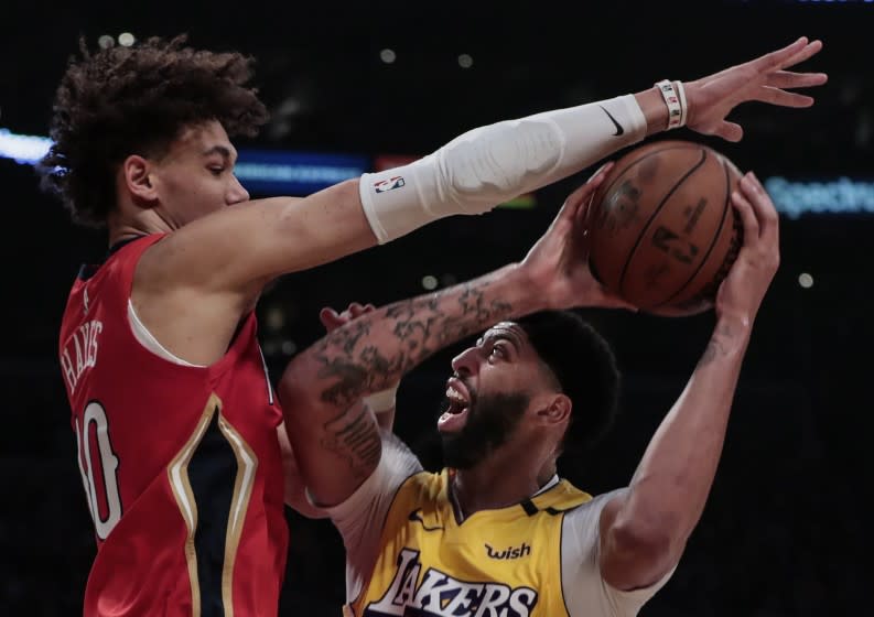 LOS ANGELES, CA, FRIDAY, JANUARY 3, 2020 - New Orleans Pelicans center Jaxson Hayes (10) fouls Los Angeles Lakers forward Anthony Davis (3) during first half action at Staples Center. (Robert Gauthier/Los Angeles Times)