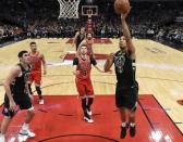 Feb 25, 2019; Chicago, IL, USA; Milwaukee Bucks guard Malcolm Brogdon (13) shoots the ball against the Chicago Bulls during the second half at United Center. Mandatory Credit: David Banks-USA TODAY Sports