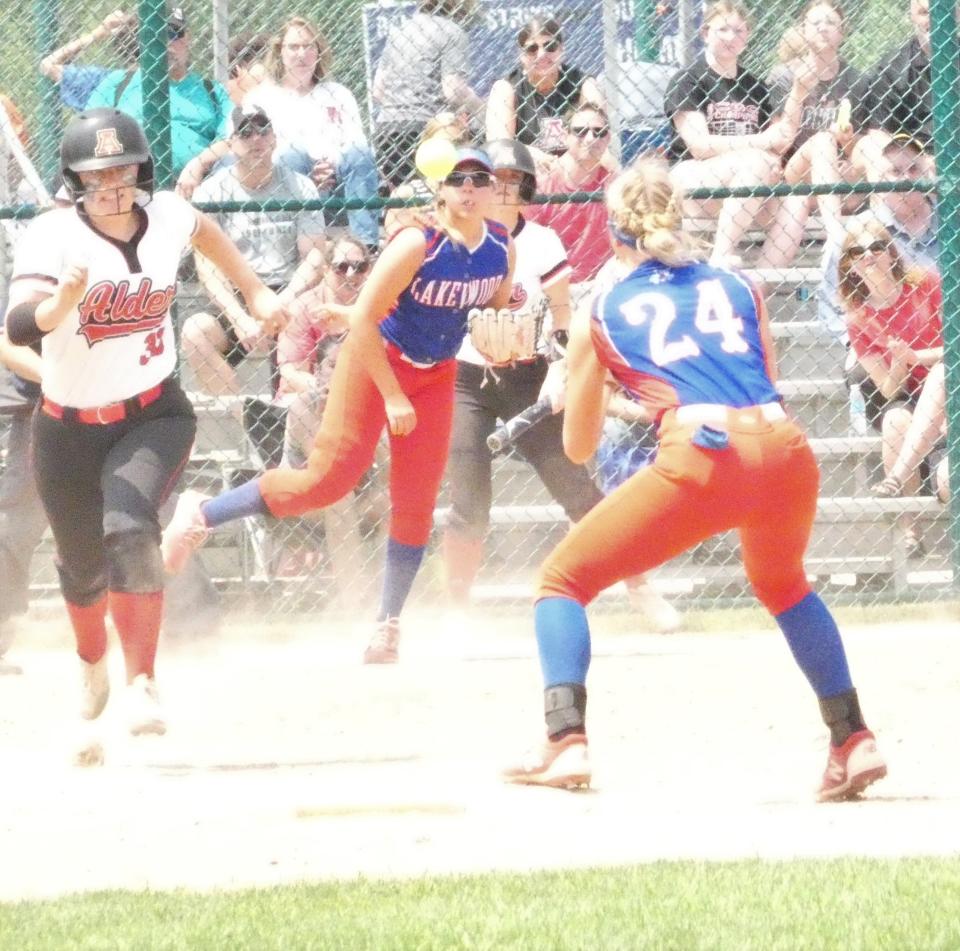 Lakewood junior third baseman Abby Colley throws to junior second baseman Audrey Thomas to retire a Jonathan Alder hitter on a bunt during a Division II district final at Pickerington Central on Saturday, May 20, 2022. The Lancers fell 4-3 as the Pioneers scored two runs in the bottom of the seventh inning.
