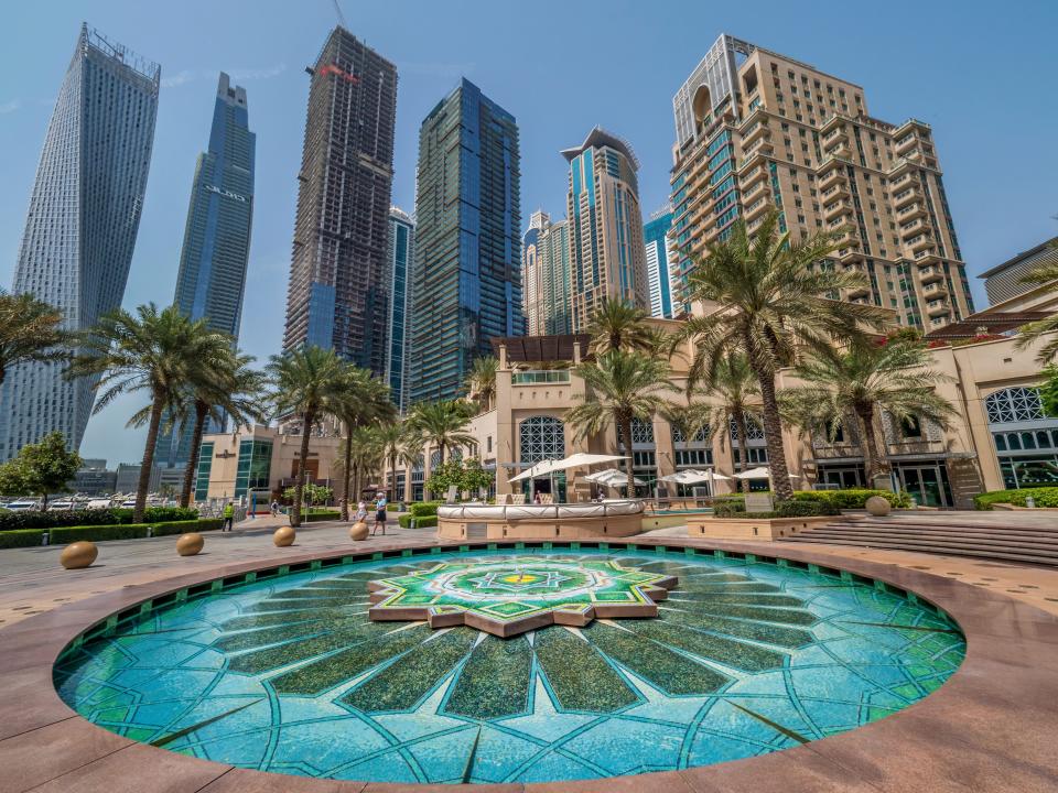 A richly coloured fountain of Arabic tile beneath the opulent residential towers of the Dubai Marina.