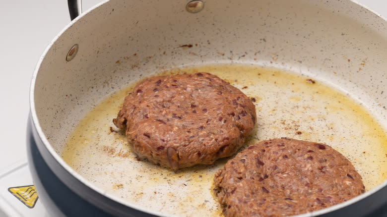 burger patties in a pan