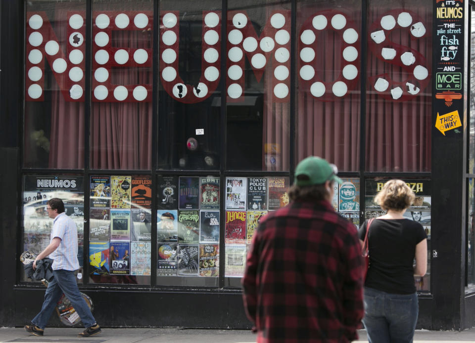 Pedestrians walk past Neumos music club in Seattle on April 10, 2014.&nbsp;&ldquo;Taking a loan right now is ludicrous until everybody understands it,&rdquo; said Steven Severin, owner and operator of Neumos. (Photo: JASON REDMOND / Reuters)