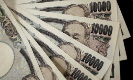 A picture illustration shows Japanese 10,000 yen notes featuring a portrait of Yukichi Fukuzawa, the founding father of modern Japan, August 2, 2011. REUTERS/Yuriko Nakao/File Photo