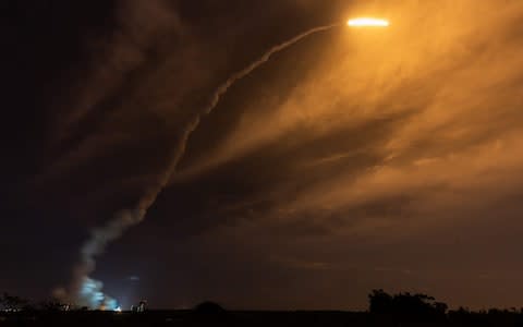 An Ariane 5 lights up the sky as it lifts off from its launchpad in Kourou, at the European Space Center in French Guiana - Credit: Jody Amiet/AFP