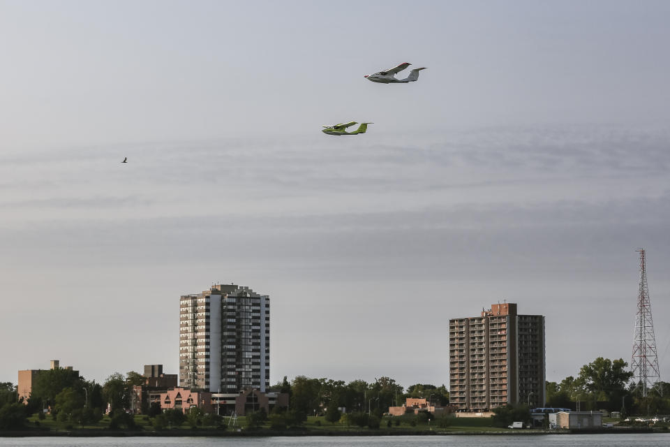 This photo provided by ICON Aircraft shows two ICON A5s, two-seat, amphibious, light-sport aircraft, flying above the Detroit River in Detroit on Thursday, Sept. 15, 2022. ICON Aircraft is one of the companies displaying their flying vehicles at the North American International Auto Show as part of the event's Air Mobility Experience segment. (ICON Aircraft via AP)