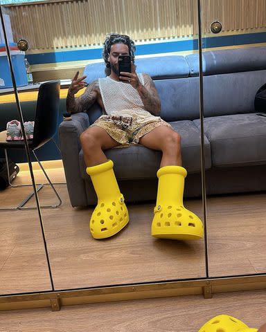 <p>Maluma Instagram</p> Maluma wears big yellow Crocs boots