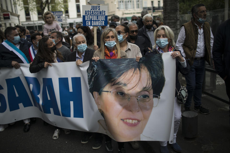 Protesters march with a banner of killed Jewish woman Sarah Halimi, during a demonstration in Marseille, southern France, Sunday, April 25, 2021. Crowds gathered Sunday in Paris and other French cities to denounce a ruling by France's highest court that the killer of Jewish woman Sarah Halimi was not criminally responsible and therefore could not go on trial. (AP Photo/Daniel Cole)