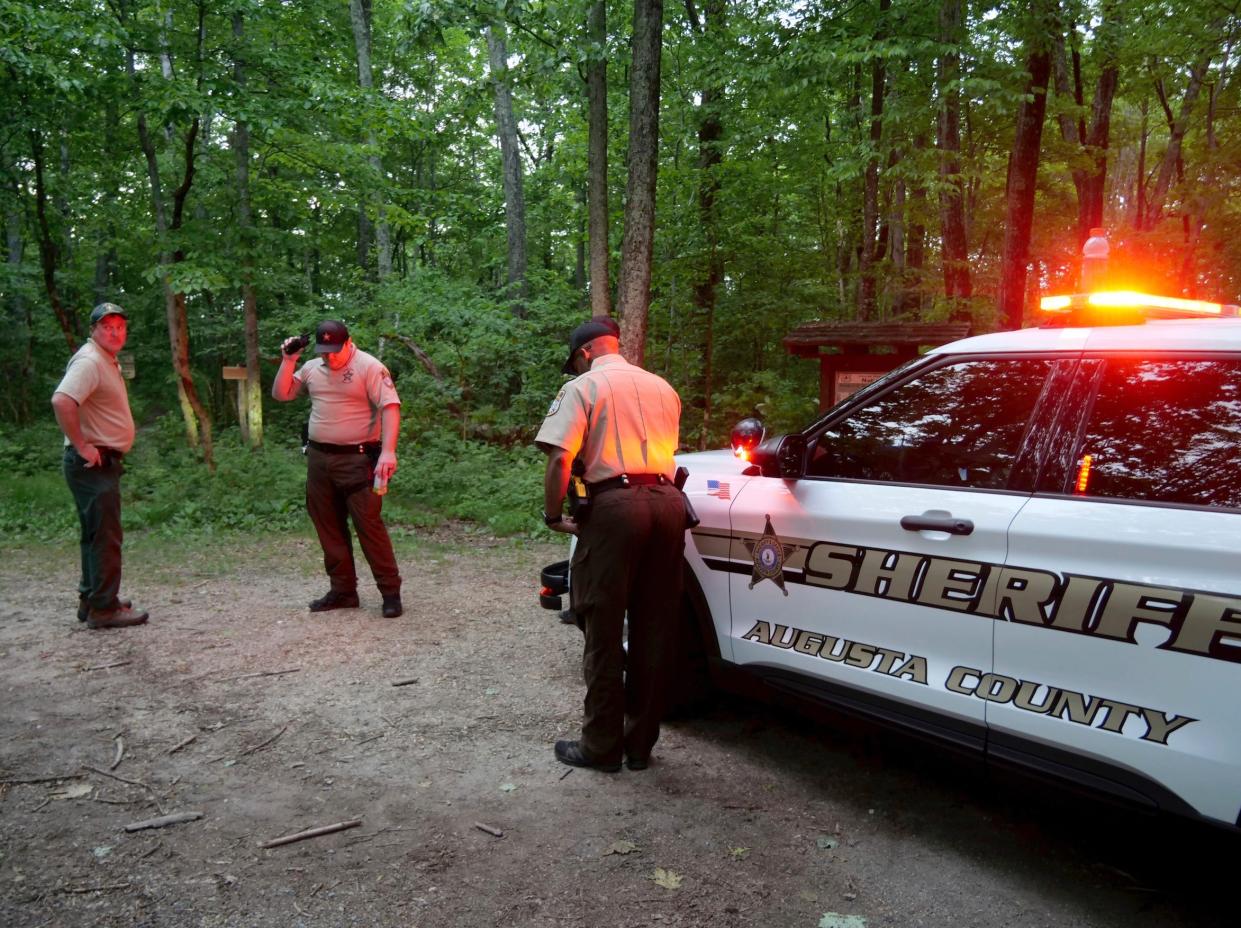 Authorities secure the entrance to Mine Bank Trail, an access point to the rescue operation along the Blue Ridge Parkway where a Cessna Citation crashed over mountainous terrain near Montebello