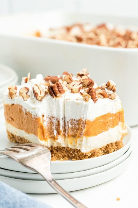 <p>Balancing Motherhood</p><p>Pumpkin lush is an easy dessert with layers of cream cheese and whipped topping with a creamy pumpkin layer in between all on top of a homemade graham cracker crust. </p><p><strong>Get the recipe: <em><a href="https://balancingmotherhood.com/pumpkin-lush/" rel="nofollow noopener" target="_blank" data-ylk="slk:Pumpkin Lush;elm:context_link;itc:0;sec:content-canvas" class="link rapid-noclick-resp">Pumpkin Lush</a></em></strong></p>