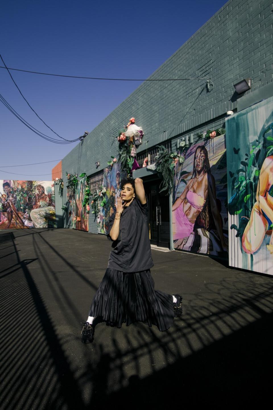 Angela Manuel-Davis in Fear of God X Nike basketball jacket; Sacai X Nike skirt; Comme des Garçons X Nike sneakers.