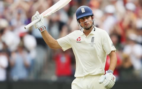 Alastair Cook raises his bat to acknowledge the dressing room after posting his double century - Credit: Michael Dodge/Getty Images