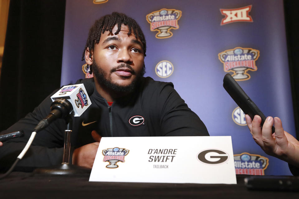 Georgia tailback D'Andre Swift, who has been injured and may or may not play in the game, takes questions from the media during the Georgia Offense press conference for the Sugar Bowl against Baylor on Sunday, December 29, 2019, in New Orleans. (Curtis Compton/Atlanta Journal-Constitution via AP)