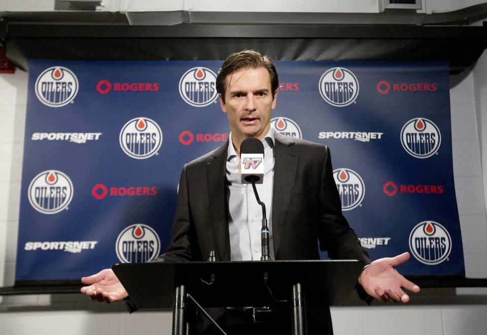 FILE - In this Dec. 16, 2014, file photo, former Edmonton Oilers head NHL hockey coach Dallas Eakins speaks to the media in Edmonton, Alberta. Dallas Eakins is the Anaheim Ducks' new coach. The Ducks announced the move Monday, June 17, 2019, filling the NHL's last head coaching vacancy with the veteran coach of their AHL affiliate in San Diego. (AP Photo/The Canadian Press, Jason Franson, File)