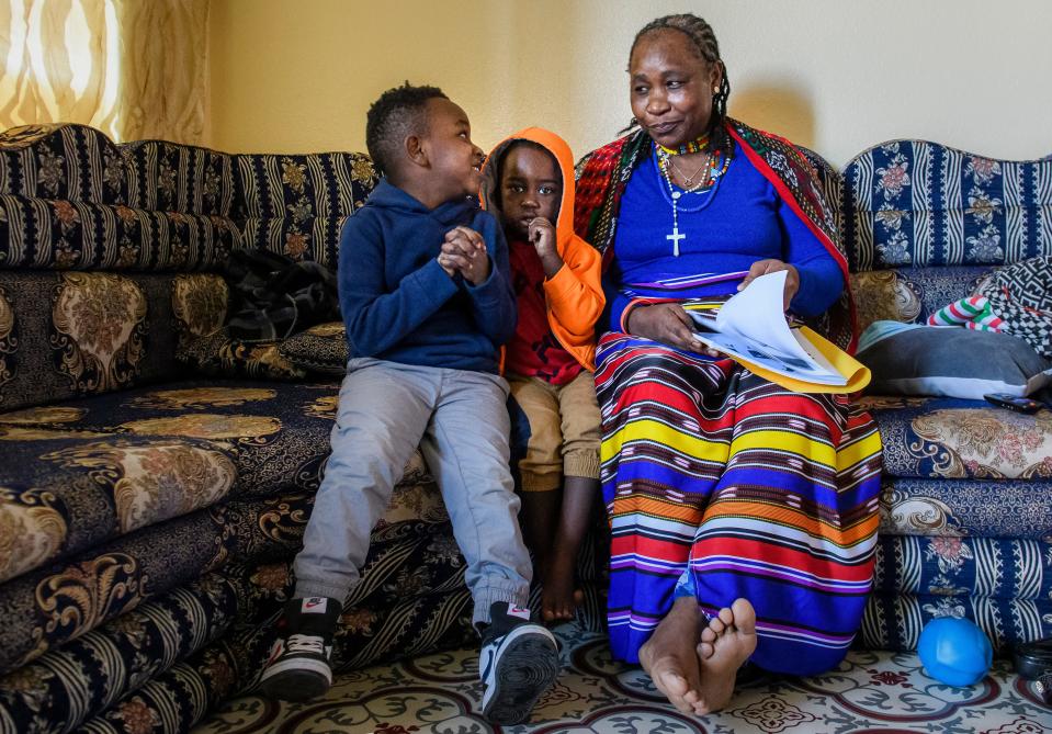 Nini Gorodo Becho, right, exchanges looks with Azel Jeke, 7, as the pair and Frances Abdella, 4, work together on the English alphabet inside her residence on March 1, in Des Moines. Becho, a native of Eritrea, is a child care provider. An installment of the Des Moines Register's series on Iowa's child care crisis focused on a unique Lutheran Services in Iowa program that trains refugees to become child care providers, offering families care that reflects their native language and culture.