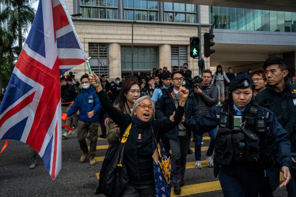 Activist Alexandra Wong, also known as Grandma Wong, holds a British flag outside the West Kowloon Law Courts (AP)