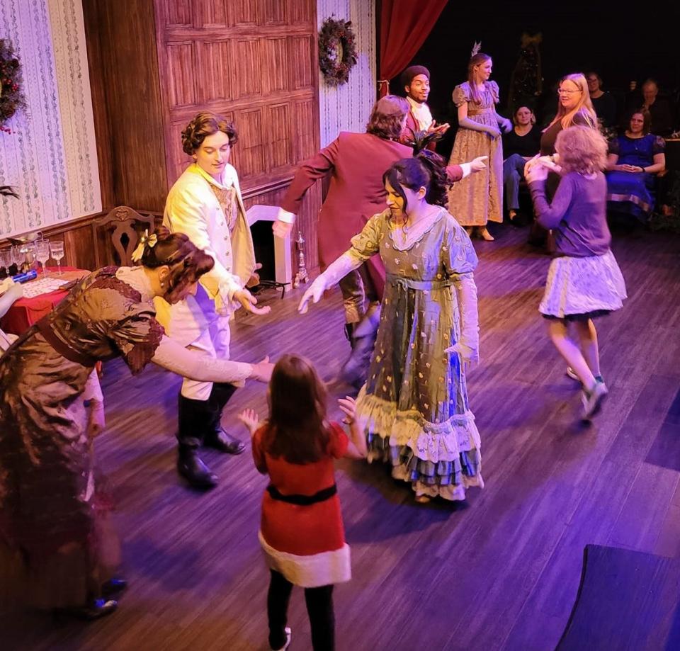 Cast and audience members dance to Regency Era country dances at the Dec. 10 performance of Oklahoma Shakespeare in the Park's original interactive holiday show "Jane Austen's Christmas Cracker" in Oklahoma City's Paseo Arts District.