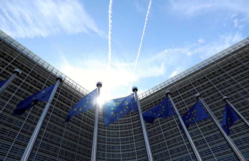 FILE PHOTO: European Union flags flutter outside the European Commission headquarters in Brussels