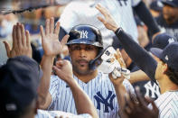 New York Yankees' Giancarlo Stanton celebrates with his teammates after scoring on a sacrifice fly by Gleyber Torres during the second inning of a baseball game Thursday, Aug. 5, 2021, in New York. (AP Photo/Mary Altaffer)