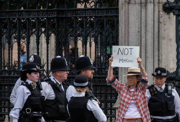 An anti-monarchy protester is escorted by police outside the Houses of Parliament ahead of King Charles address to parliament on Sept. 12, 2022. (Photo: Chris J Ratcliffe via Getty Images)