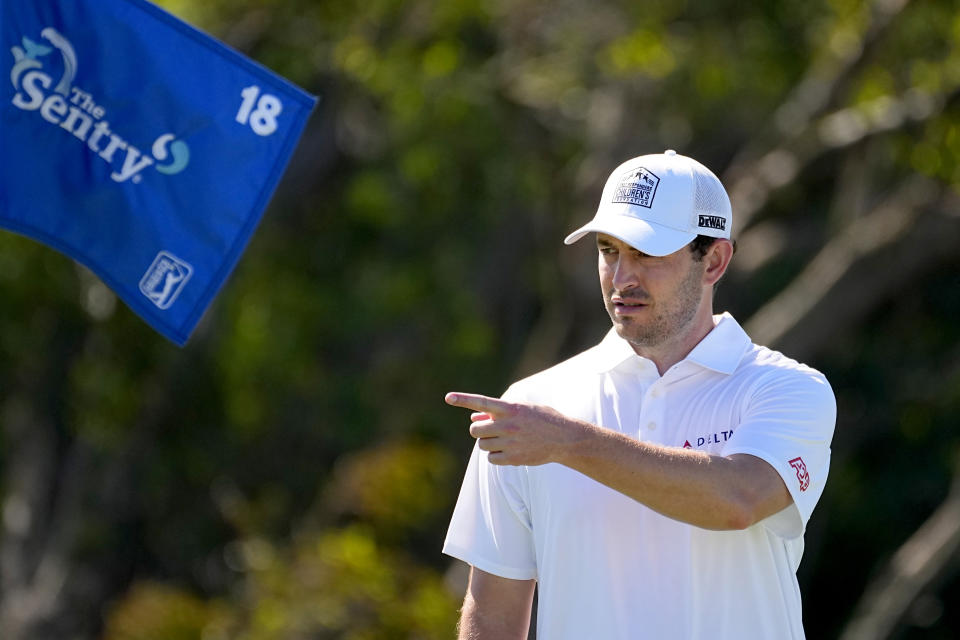 Patrick Cantlay motions from the 18th green during the pro-am round of The Sentry golf event, Wednesday, Jan. 3, 2024, at Kapalua Plantation Course in Kapalua, Hawaii. (AP Photo/Matt York)