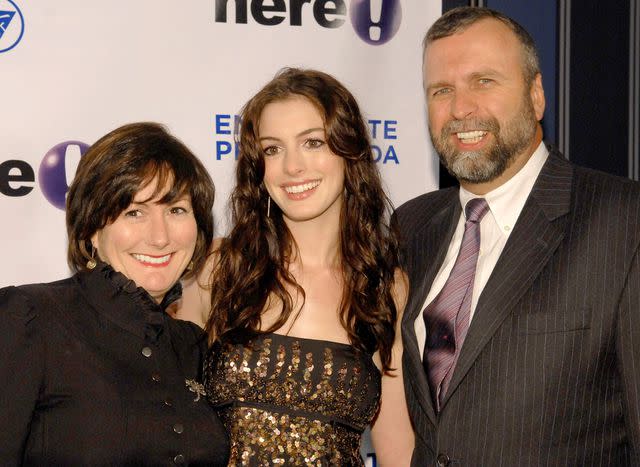 <p>Jemal Countess/WireImage</p> Kate McCauley Hathaway, Anne Hathaway and Gerald "Jerry" Hathaway pose for a photo at an event.