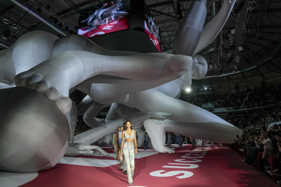 A model wears a creation as part of the Diesel women's Spring Summer 2023 collection presented in Milan, Italy, Wednesday, Sept. 21, 2022. (AP Photo/Antonio Calanni)