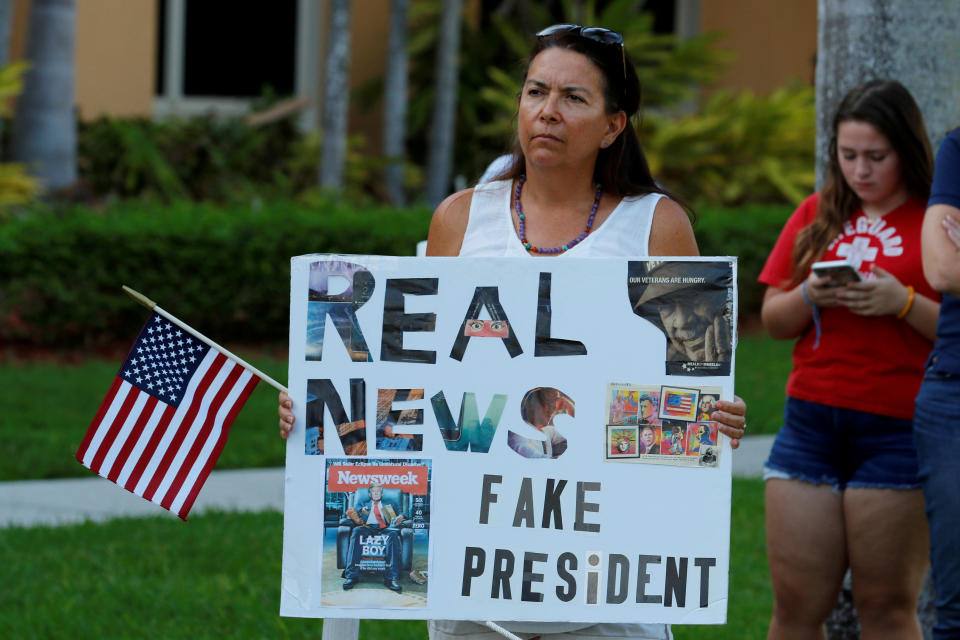 <p>A protester holds a sign at a Call To Action Against Gun Violence rally by the Interfaith Justice League and others in Delray Beach, Fla., Feb. 19, 2018. (Photo: Joe Skipper/Reuters) </p>