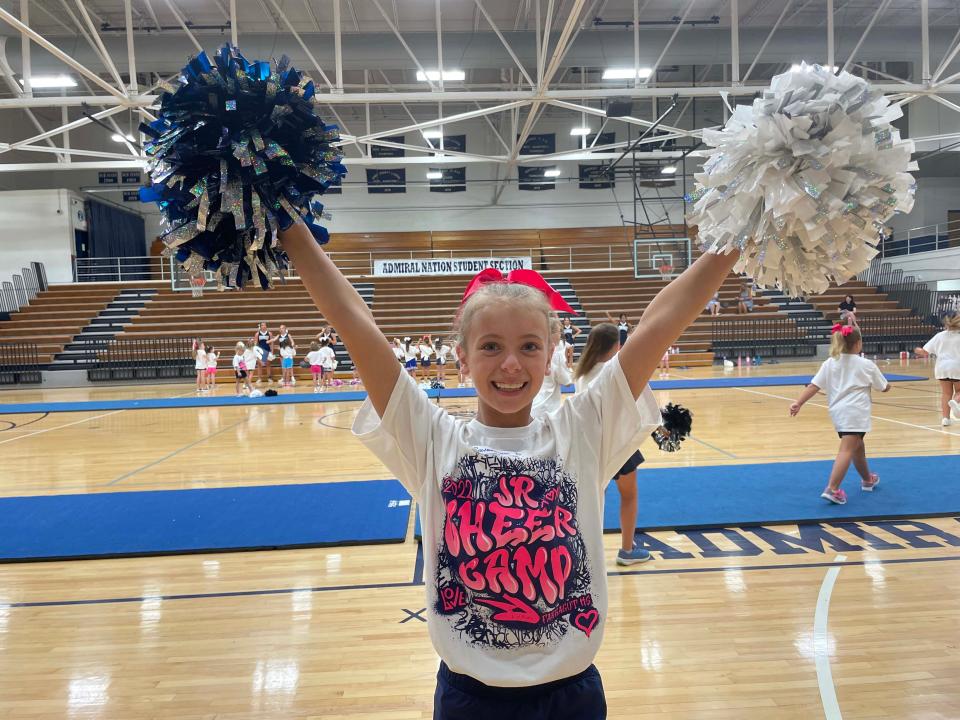 Savannah P. shows off her school spirit at a cheerleading camp held at Farragut High School Wednesday, June 15, 2022.