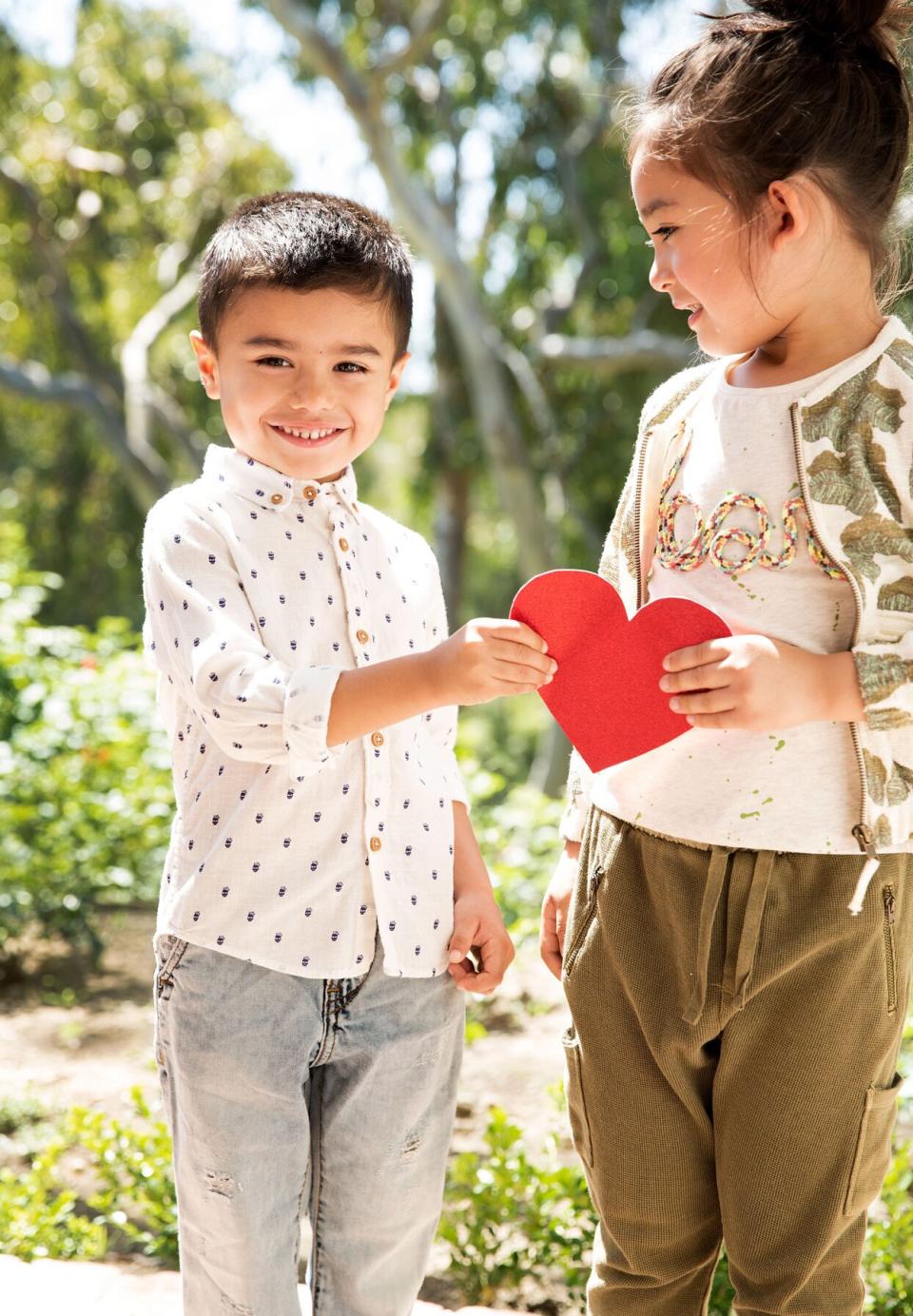 kids holding heart cutout