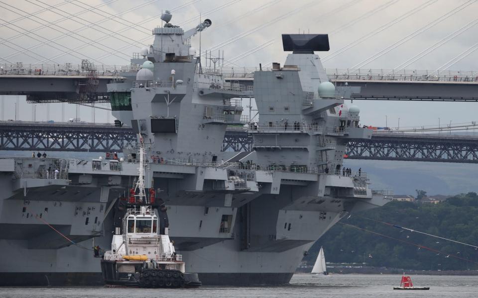 HMS Queen Elizabeth, one of two new aircraft carriers for the Royal Navy, on the Firth of Forth after leaving the Rosyth dockyard near Edinburgh - Credit:  Andrew Milligan/PA