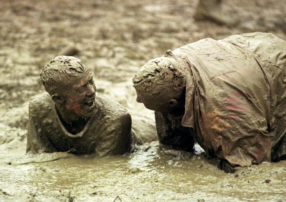 Dirty weekend: These two revellers were determined to have a good time whatever the conditions in 1998.