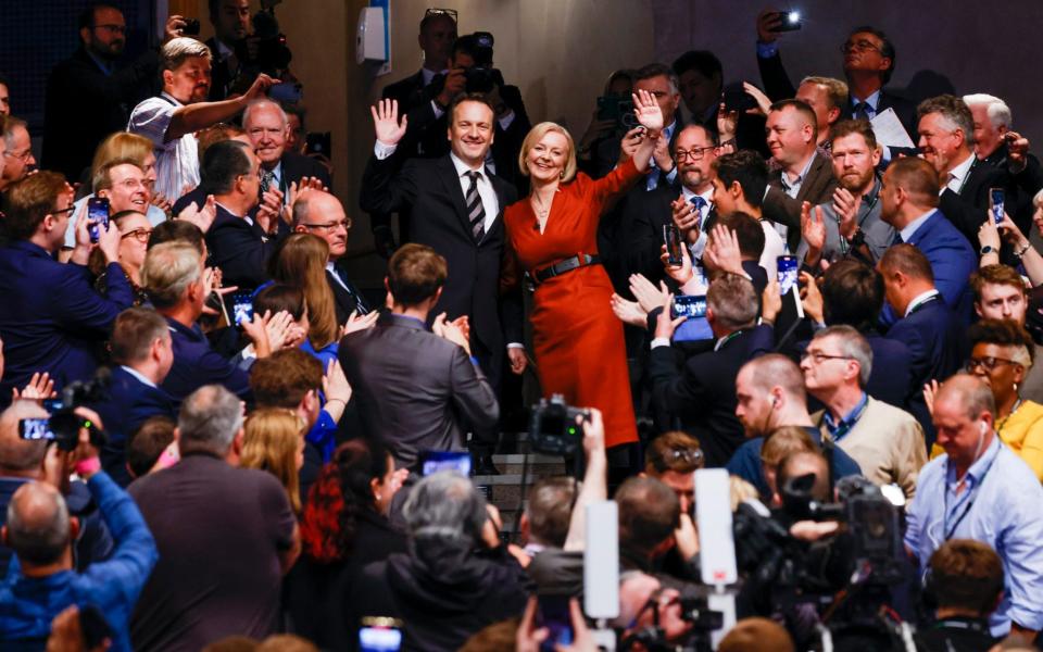 Liz Truss waves to Tory activists after finishing her speech in Birmingham - Geoff Pugh for The Telegraph